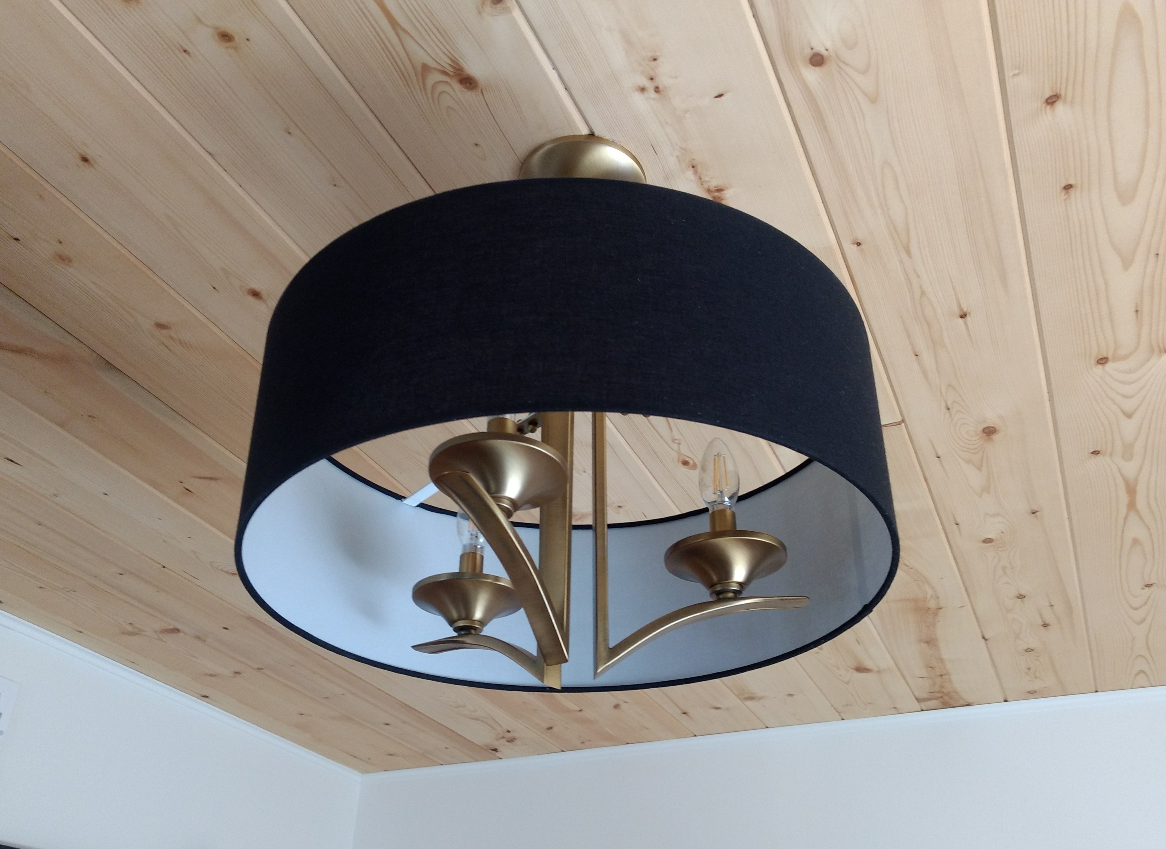 Tongue and groove ceiling install with minimalistic chandelier